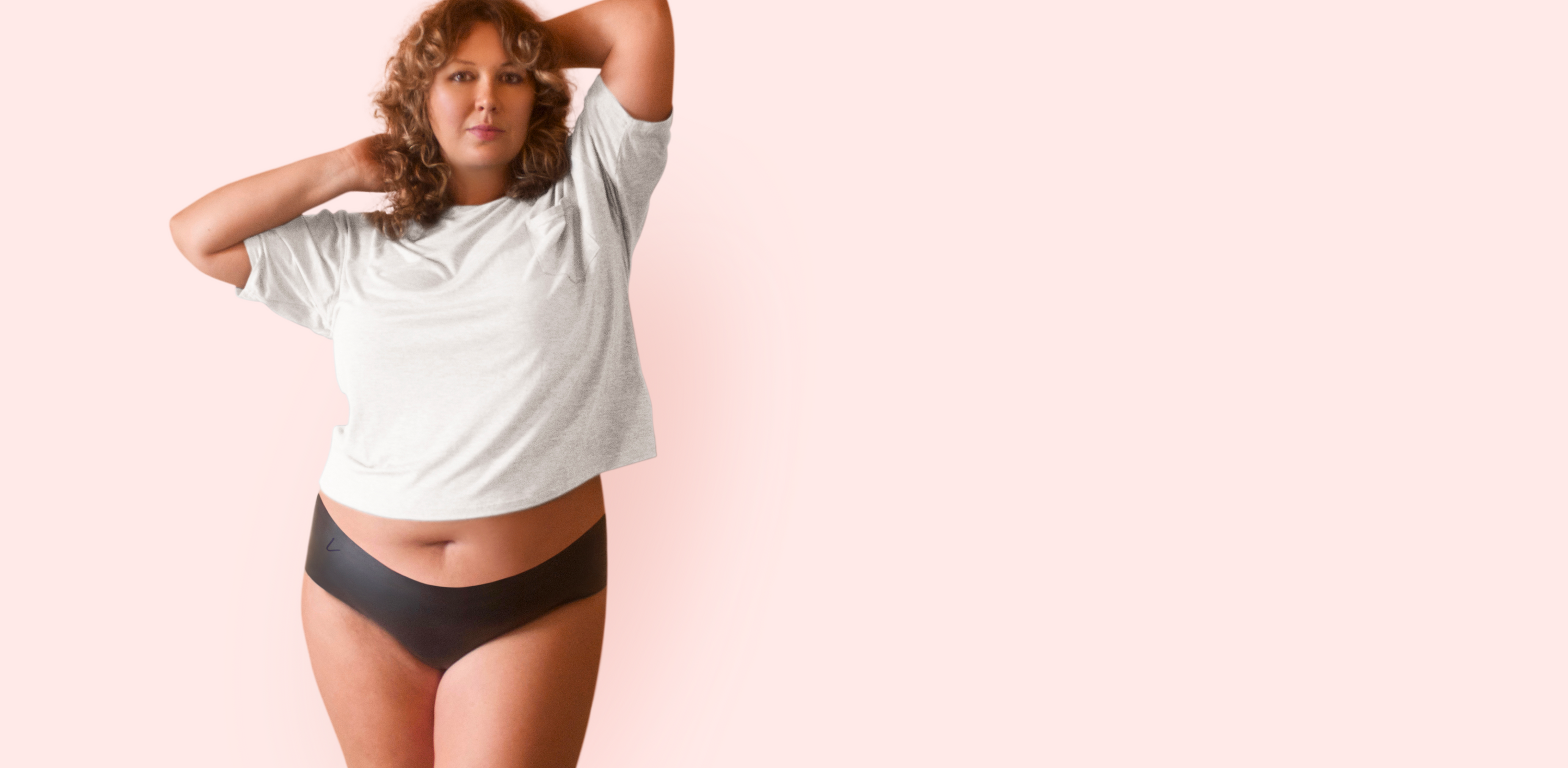 Plus-size model wearing Lorals latex underwear, empowering safer oral sex options for all bodies.