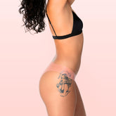 Lorals model Ahyoka demonstrates the profile view of Pleasure Undies in Sheer Peach Bikini Style