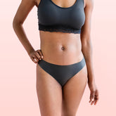 Lorals model Gladys demonstrates the front view of Pleasure Undies in Black Bikinis